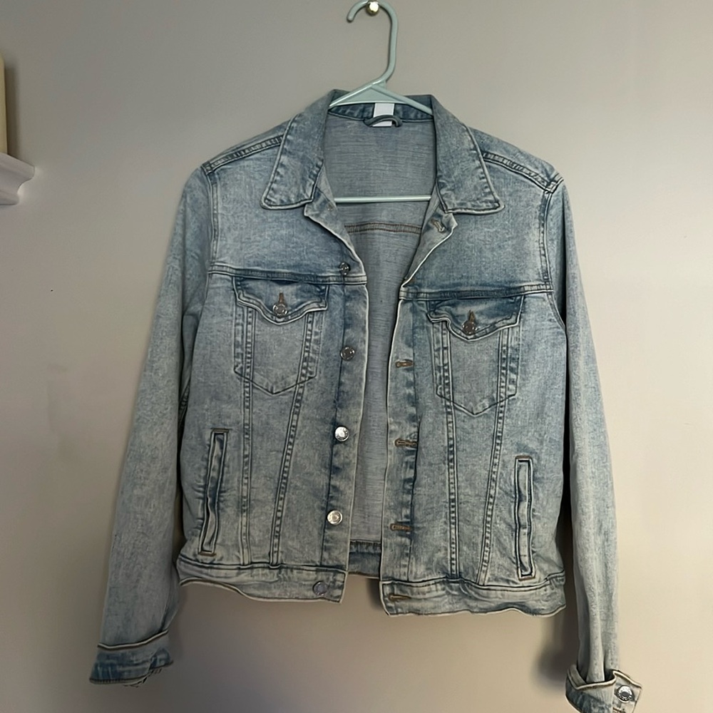 light wash jean jacket with button clasps, runs small